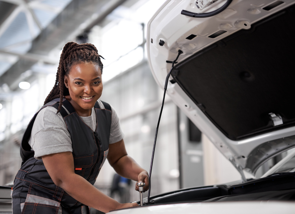 Mechanic With Car Hood Open